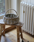 small round rattan basket with handle