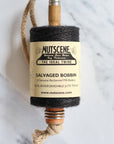 twine hung on vintage mill bobbin