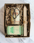 nutscene gardeners gift box with garden scissors and two twine balls, wooden seed labels packaged in a vintage style kraft box