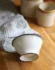 small footed enamel bowl white
