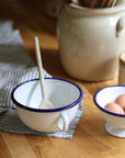 enamel bowl with handle and navy trim detail