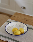low white enamel bowl with flower detail