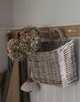 rattan basket with loop to hang on a hook