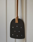 wood and leather fly swat