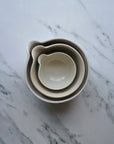 Beige ceramic bowl on a marble surface