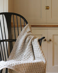 aran wool blanket in flecked oat colour, made in ireland