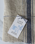 rustic beige linen table runner, with a blue stripe. French style.