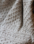 aran wool blanket in flecked oat colour, made in ireland