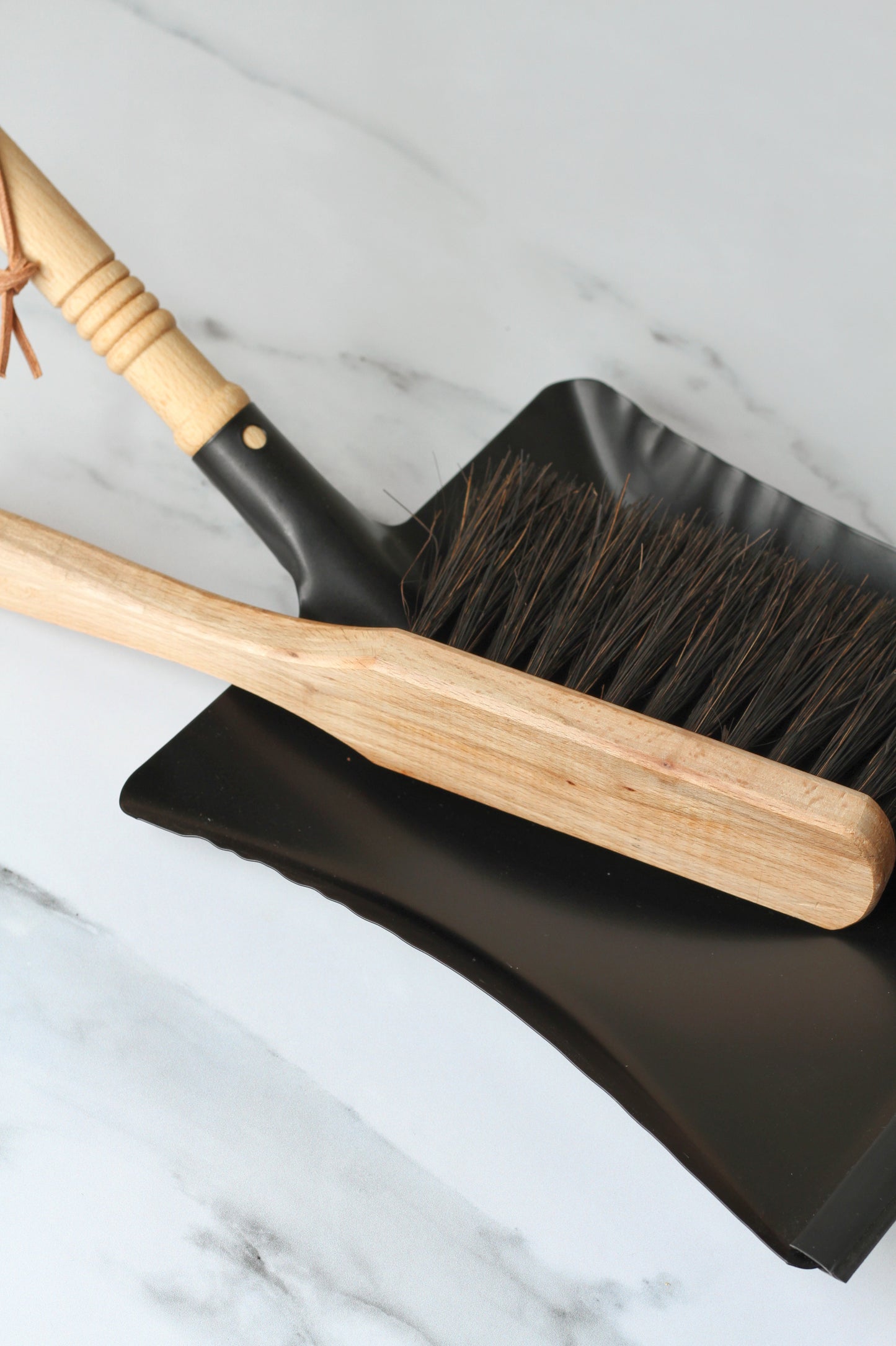 black metal dustpanblack metal dustpan with wooden handle  and wooden brush