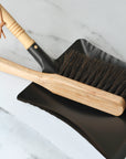 black metal dustpanblack metal dustpan with wooden handle and wooden brush