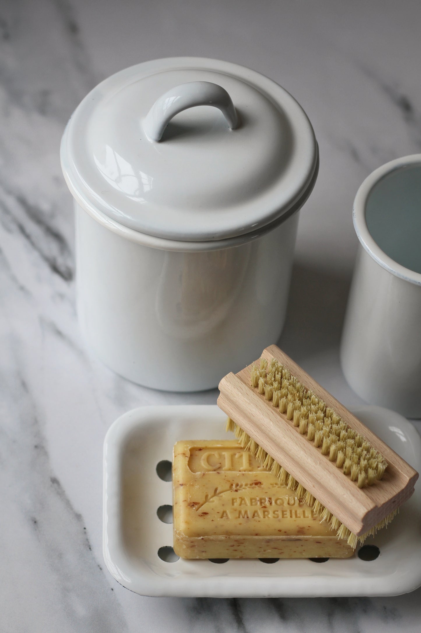 white enamel jar with lid