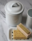 white enamel jar with lid