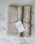 Rustic linen table runner in beige with a french style green stripe
