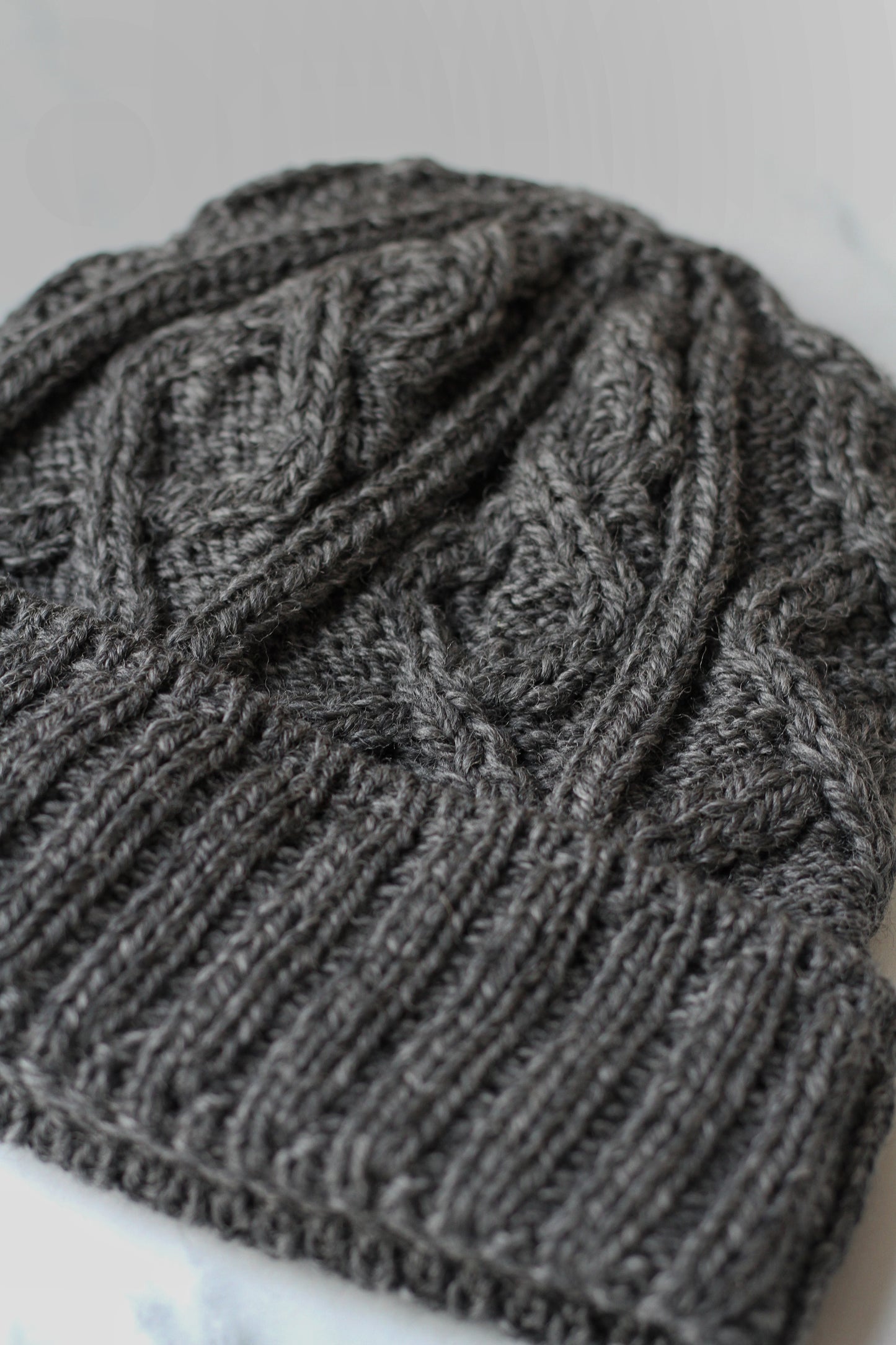 aran merino wool hat with a diamond stitch in charcoal grey