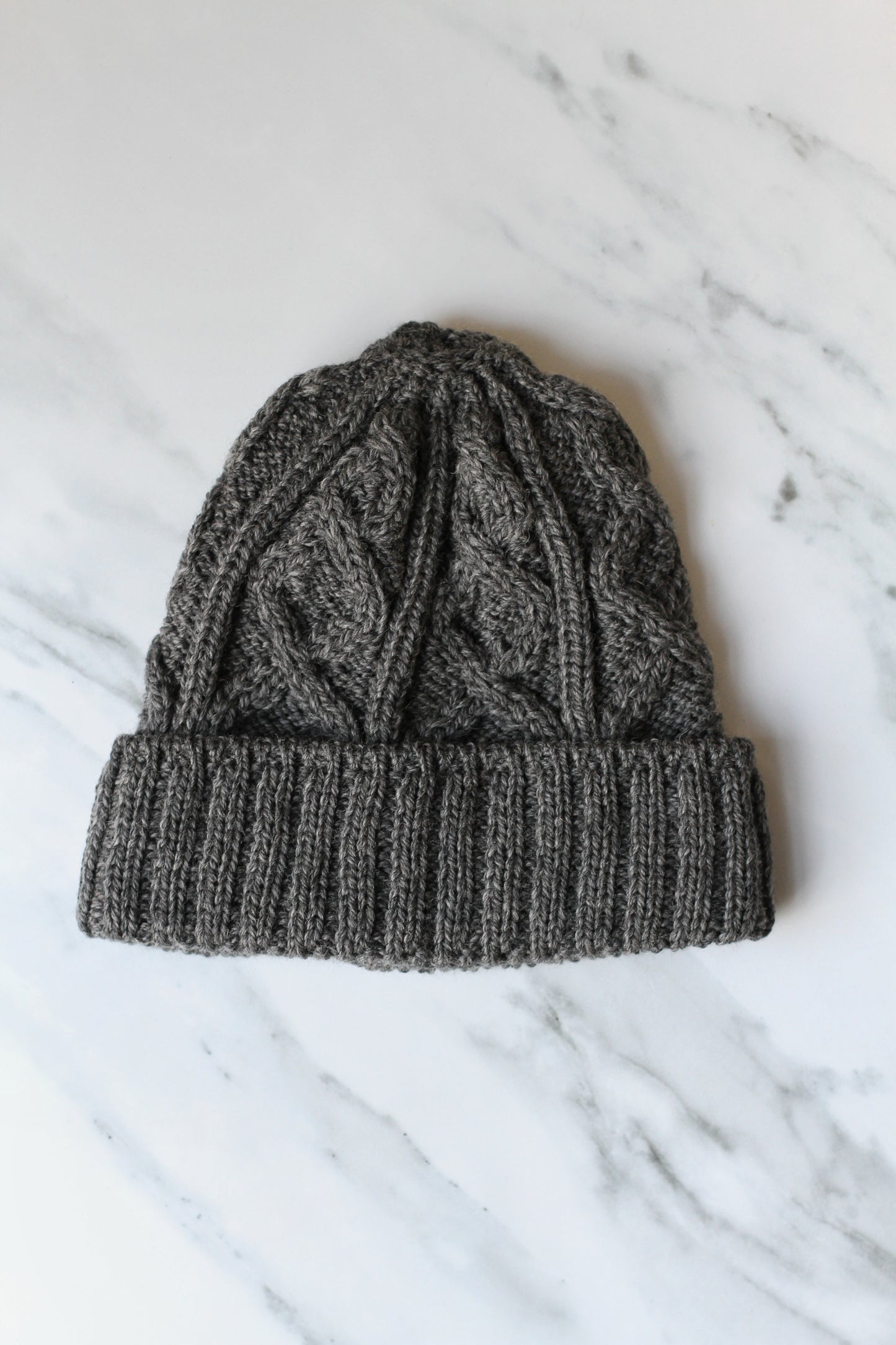 aran merino wool hat with a diamond stitch in charcoal grey