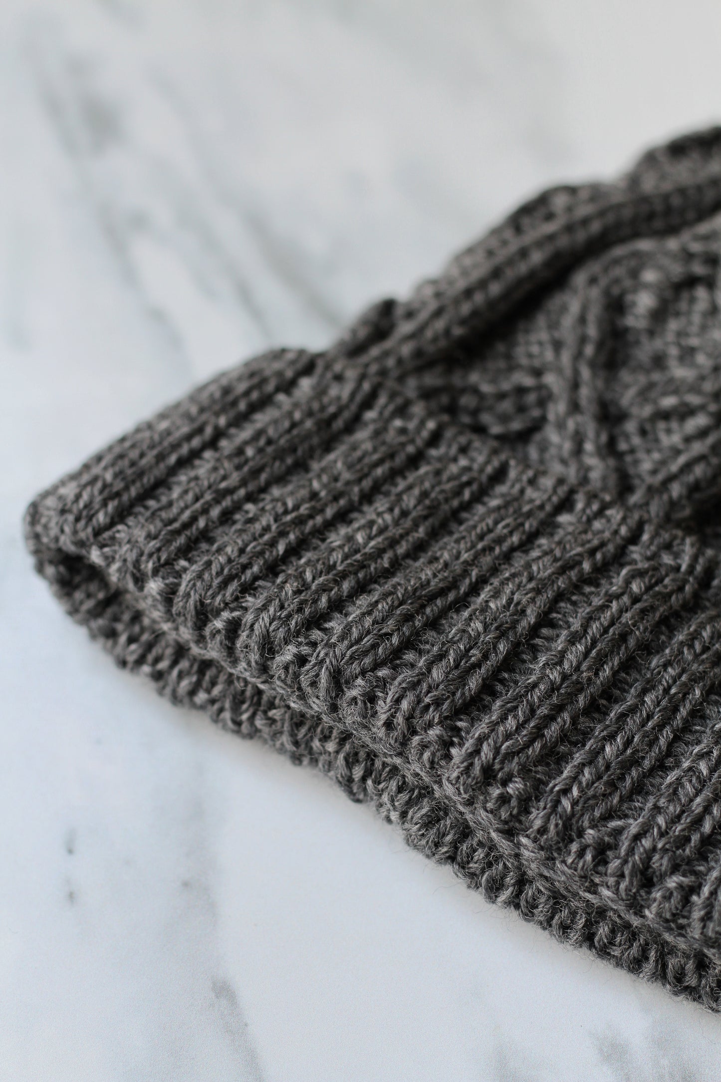 aran merino wool hat with a diamond stitch in charcoal grey