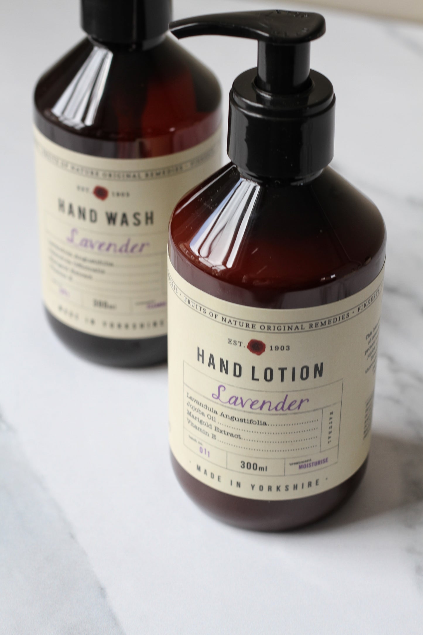 lavender hand wash and hand lotion in amber bottle