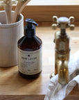 lavender hand wash and hand lotion in amber bottle