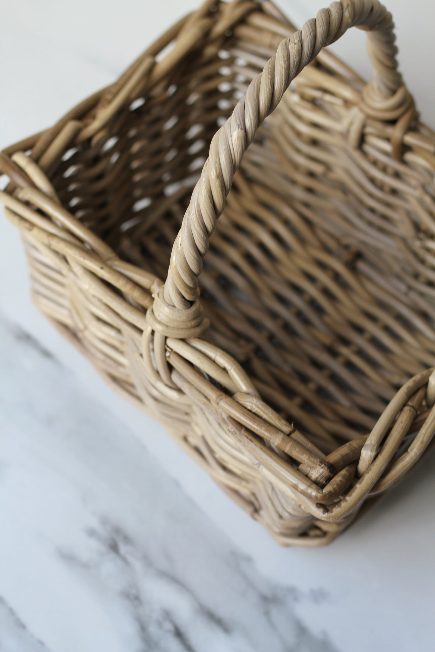 small grey wash rattan basket with handle