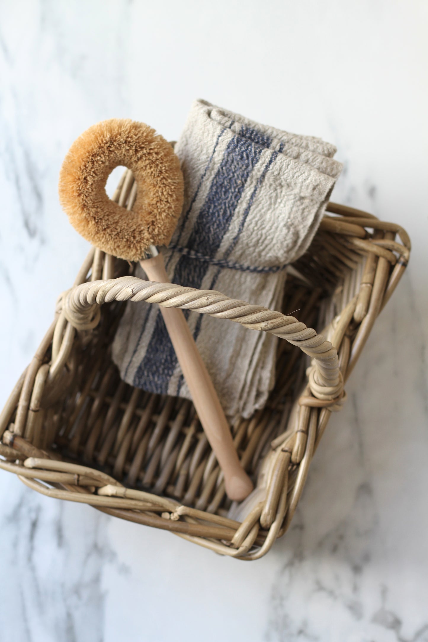small grey wash rattan basket with handle