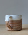 terradotta mug handmade with a white glaze rim