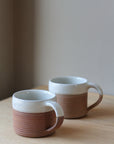 terradotta mug handmade with a white glaze rim