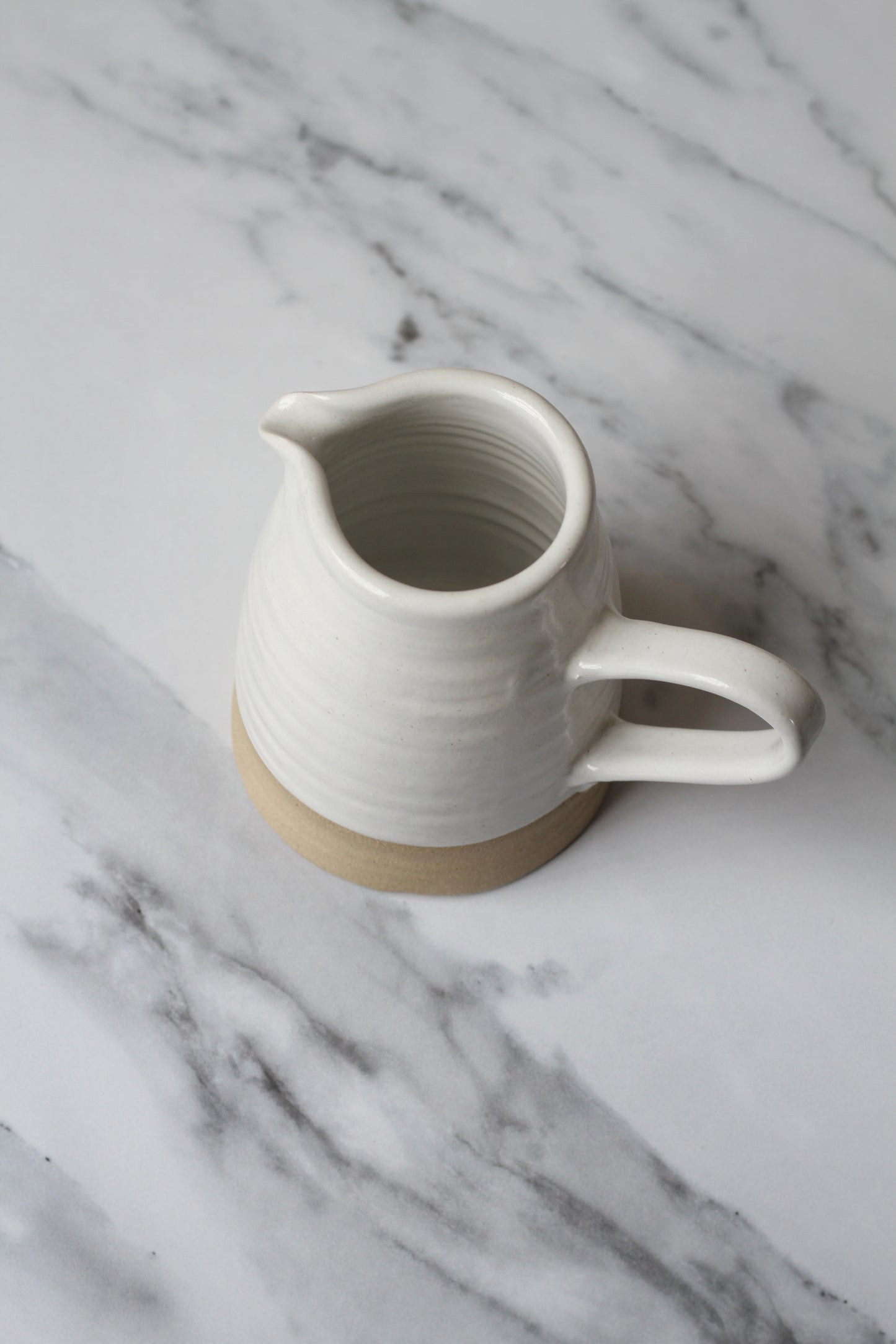 handmade stoneware jug with white glaze made in york by potter philip magson