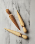 wooden seed dibber for making a hole in soil before planting a seed