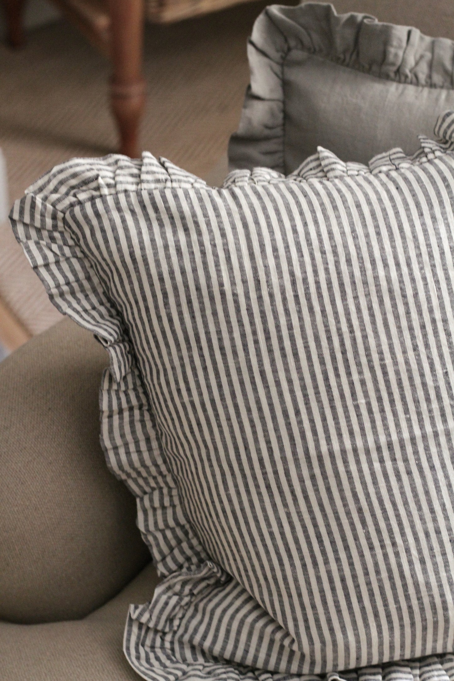 frilled linen cushion available in natural and thin black stripe line, comes with duck feather inner