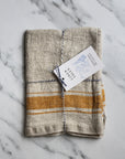 rustic linen tea towel natural linen colour with a mustard yellow stripe