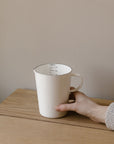 white enamal measuring jug