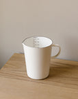 white enamal measuring jug
