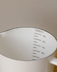white enamal measuring jug