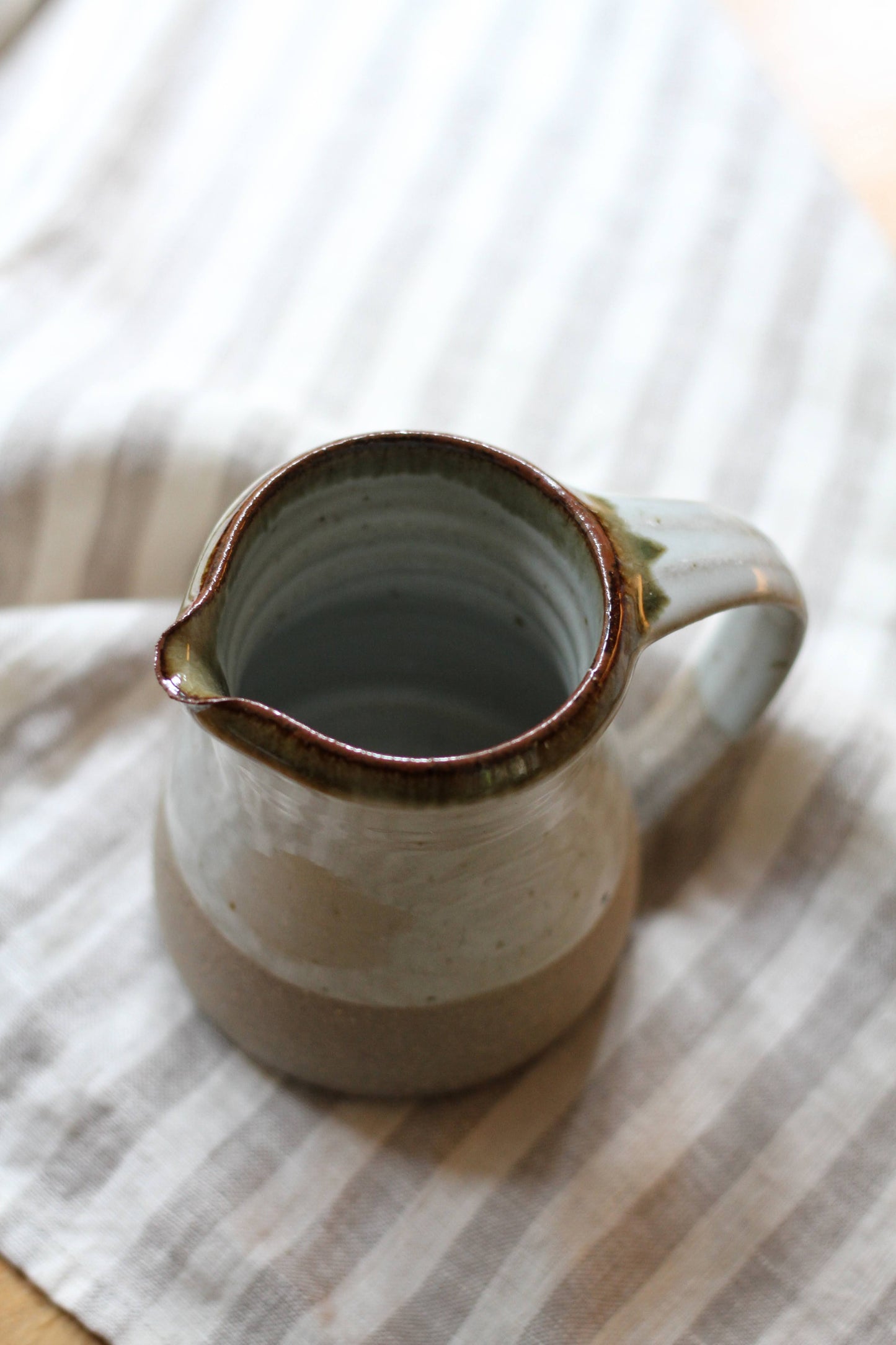 small leach pottery jug in dolomite glaze