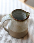 small leach pottery jug in dolomite glaze