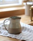 small leach pottery jug in dolomite glaze