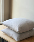 100% linen cushion with feather inner available in olive and natural