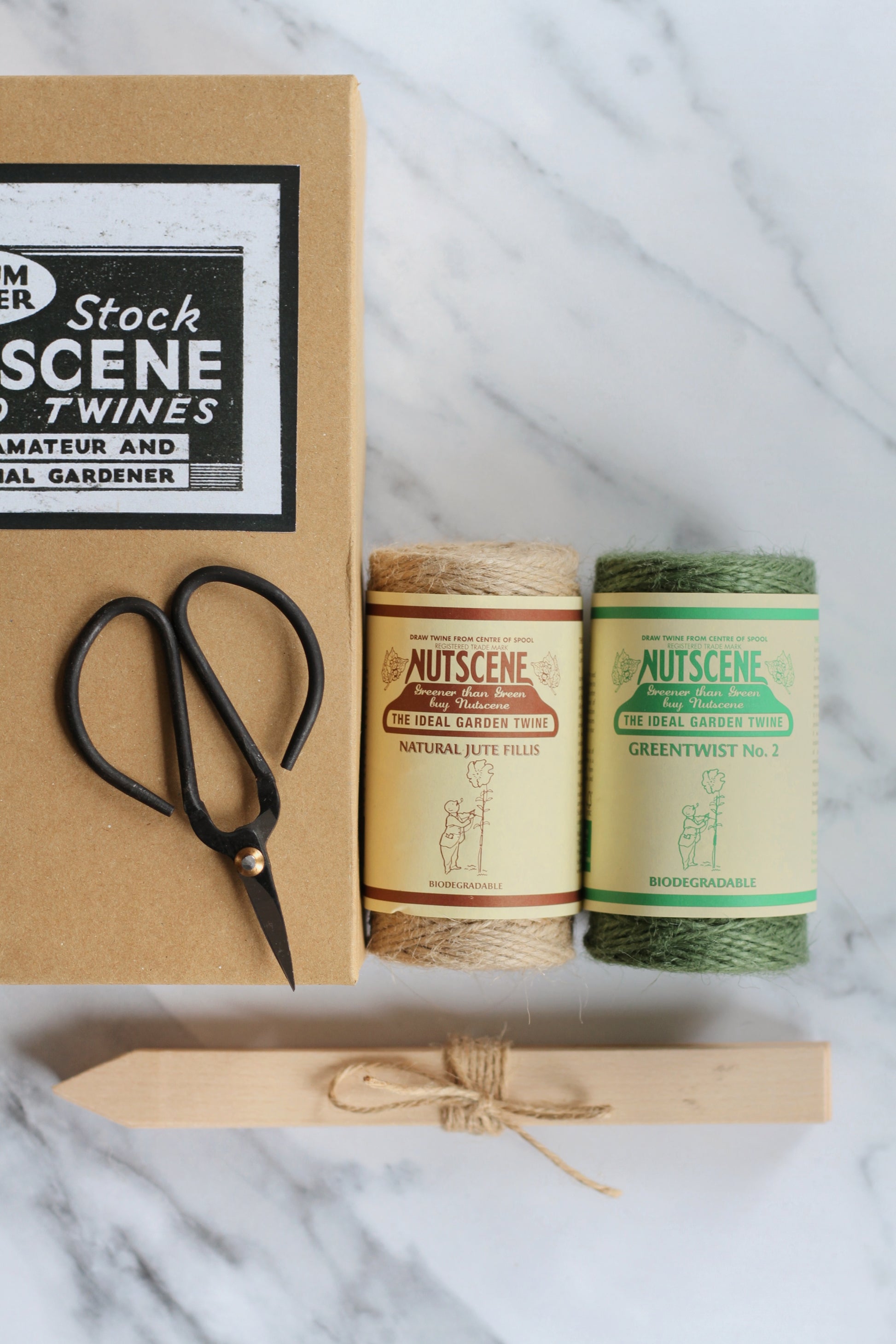 nutscene gardeners gift box with garden scissors and two twine balls, wooden seed labels packaged in a vintage style kraft box