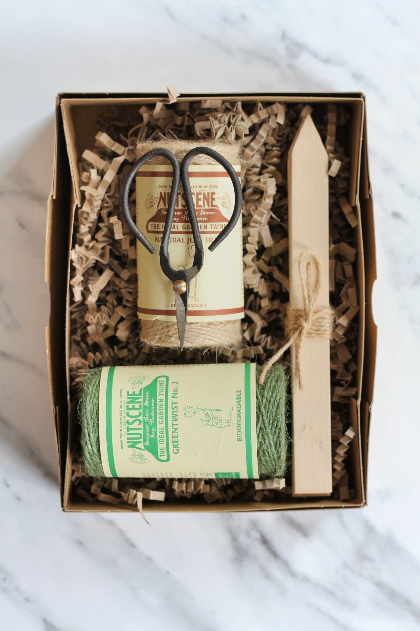 nutscene gardeners gift box with garden scissors and two twine balls, wooden seed labels packaged in a vintage style kraft box