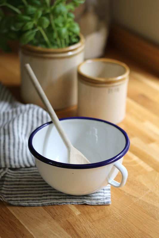 enamel bowl with handle and navy trim detail