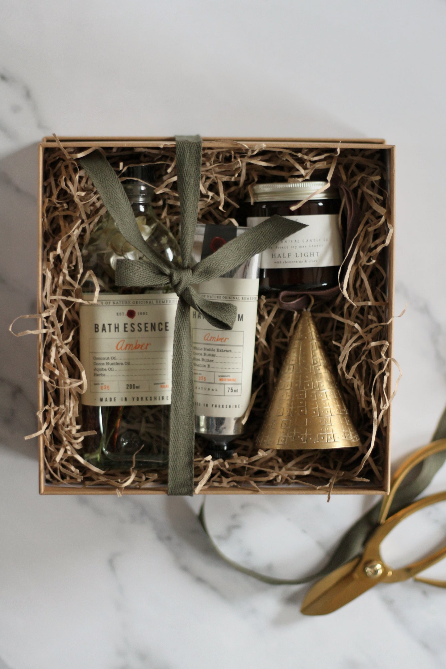 gift box with bath essence, hand cream, candle, brass bell