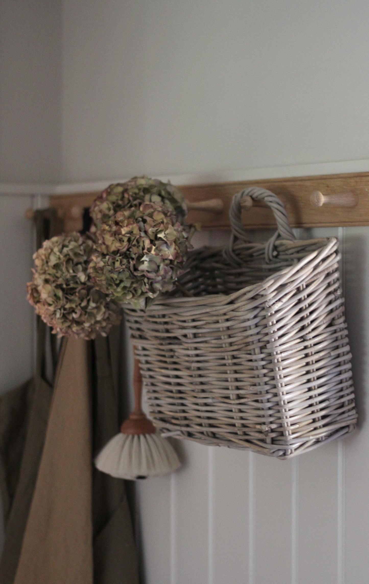 rattan basket with loop to hang on a hook