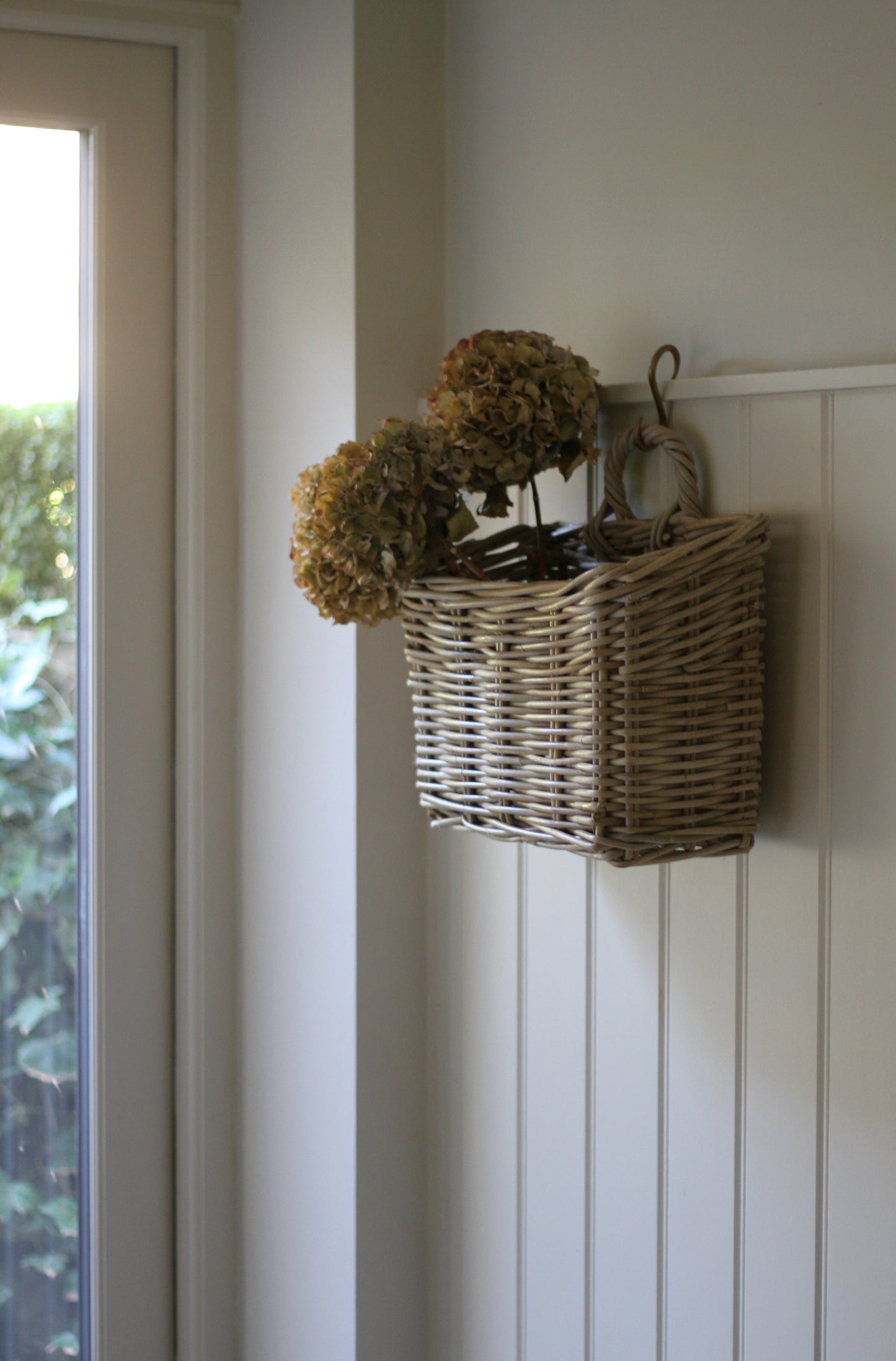 rattan basket with loop to hang on a hook