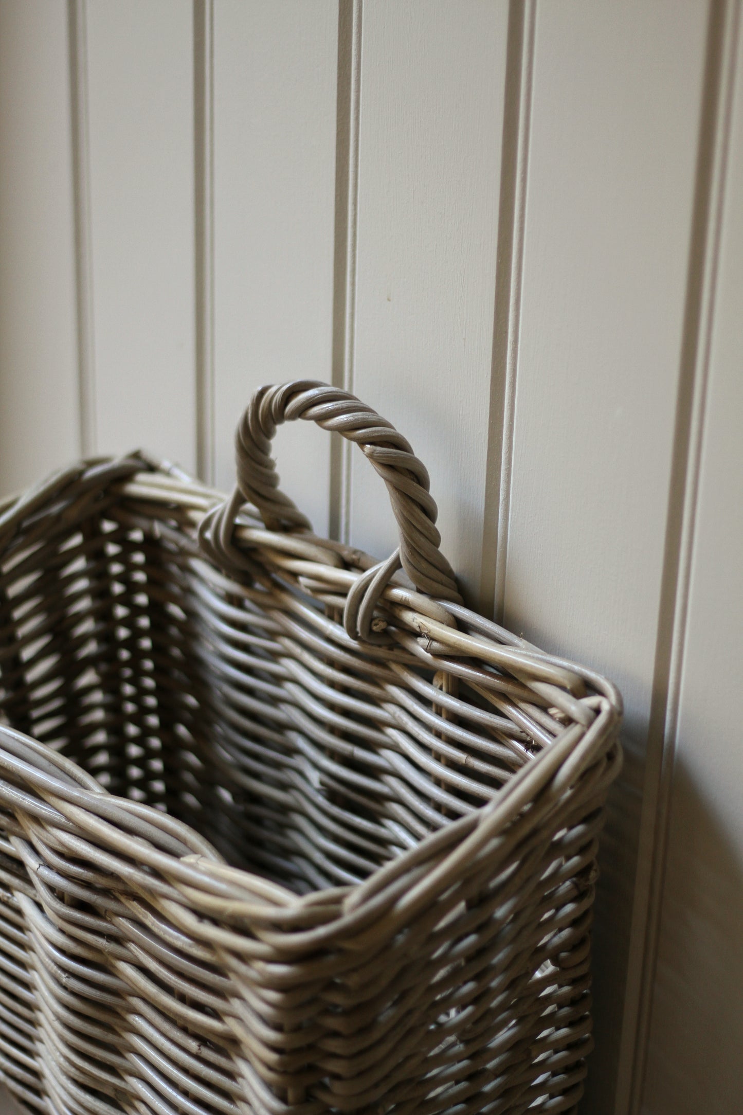 rattan basket with loop to hang on a hook