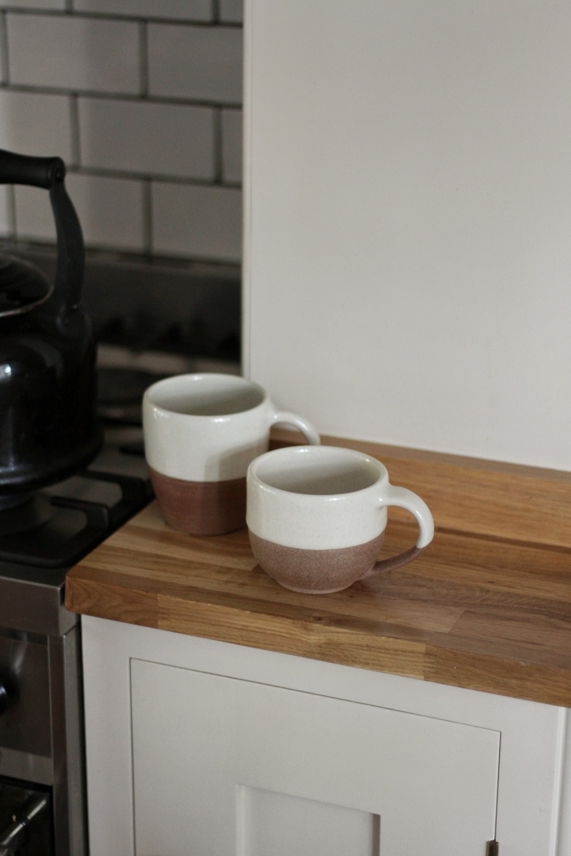 terracotta mug with white glaze top detail available in small and large 