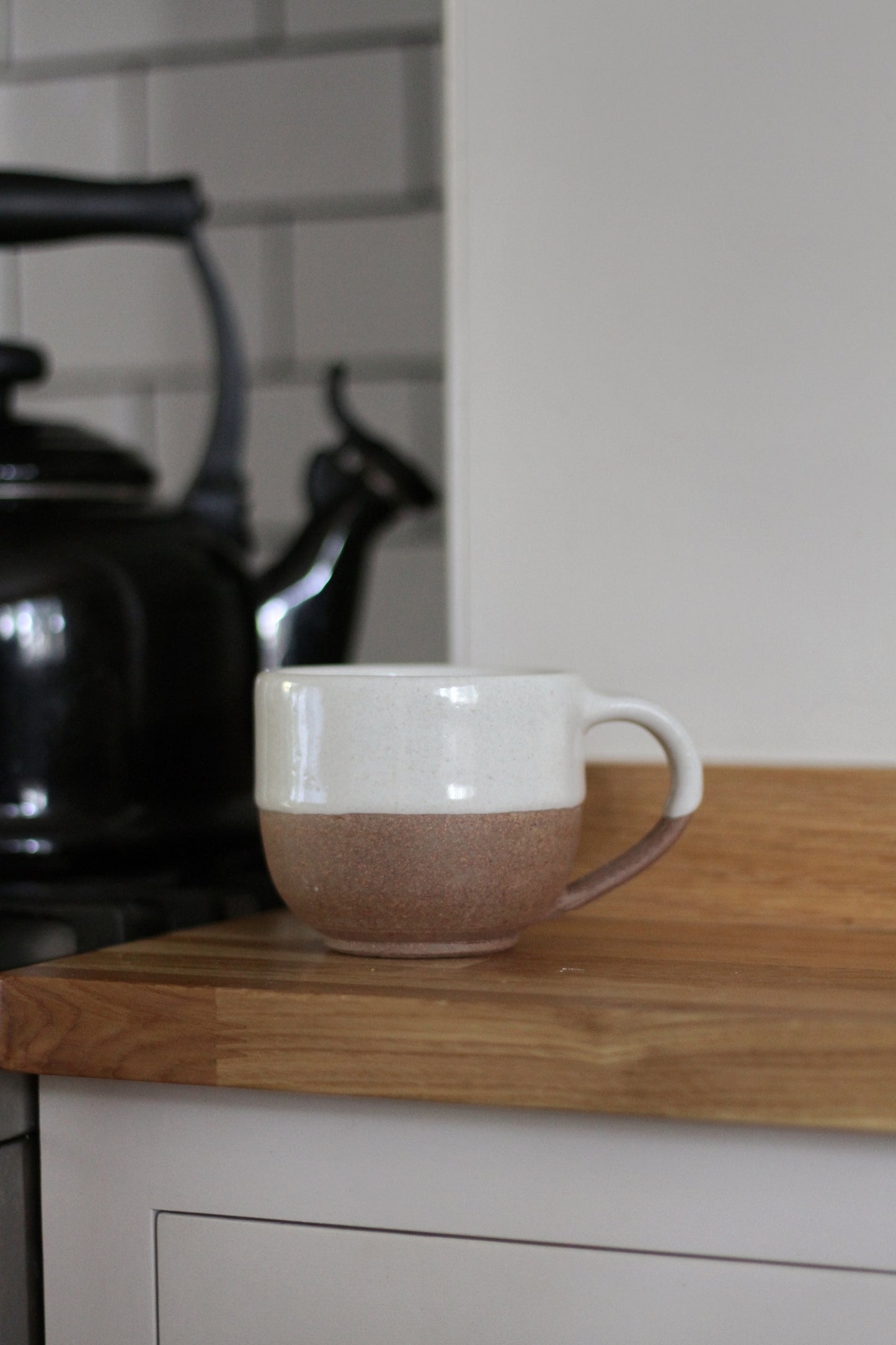 terracotta mug with white glaze top detail available in small and large 