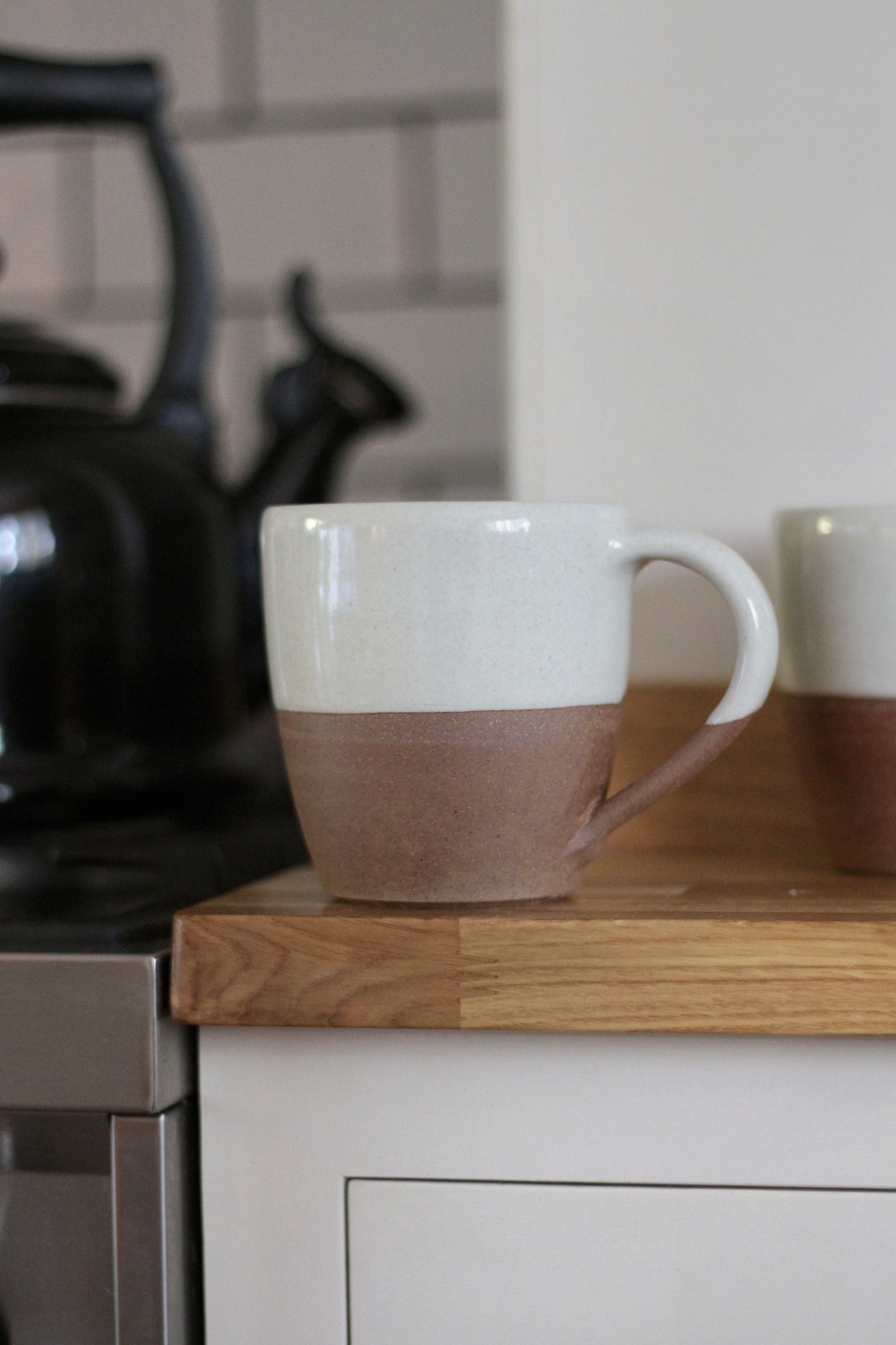 terracotta mug with white glaze top detail available in small and large 