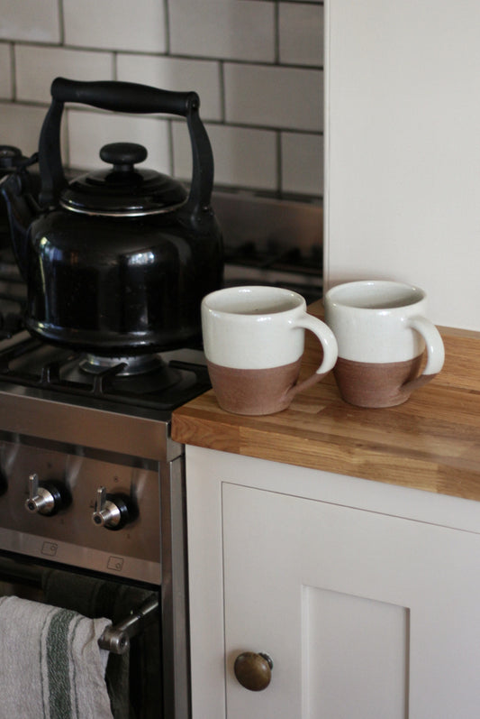 terracotta mug with white glaze 