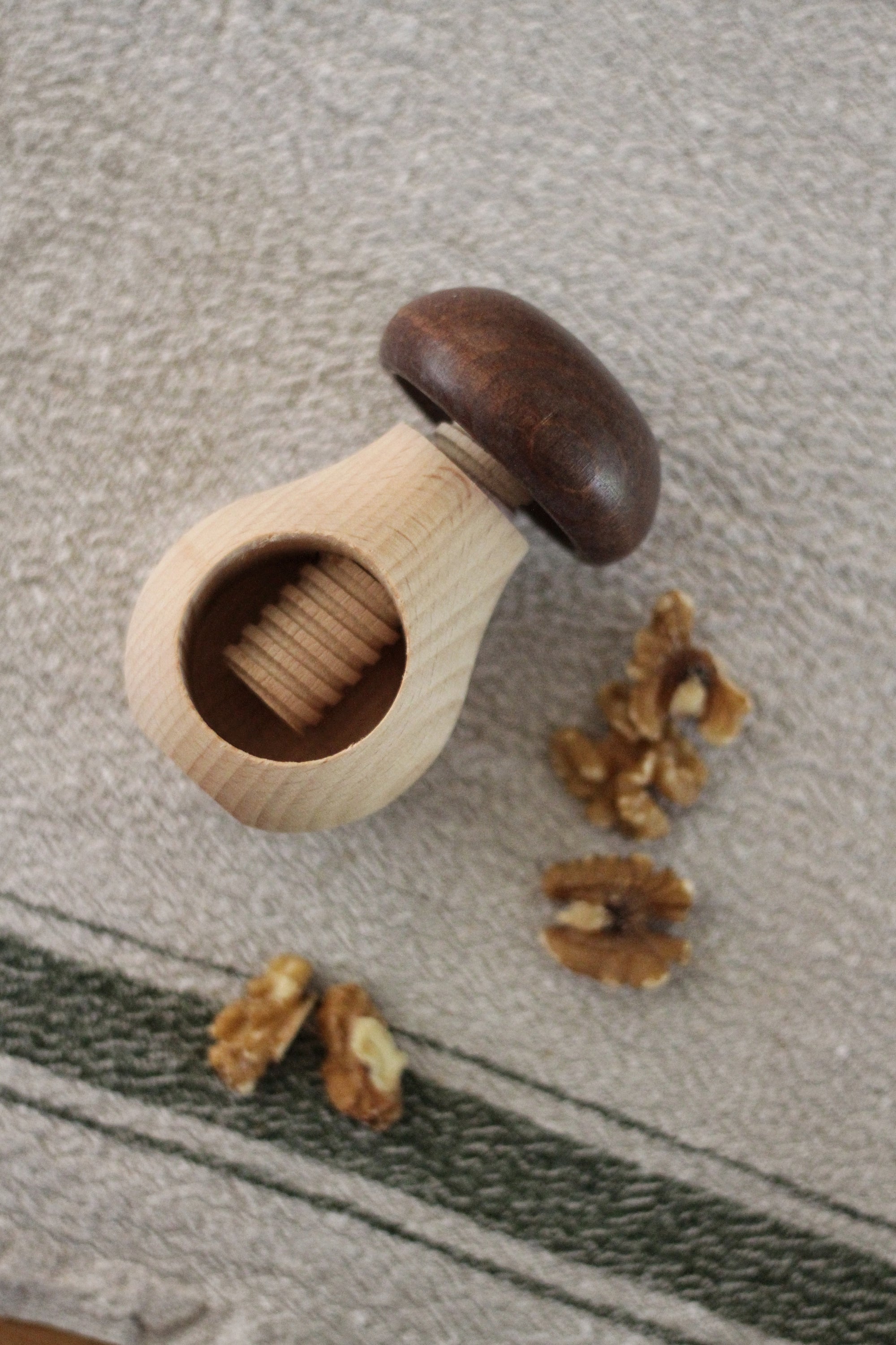 wooden nutcracker in the shape of a mushroom 