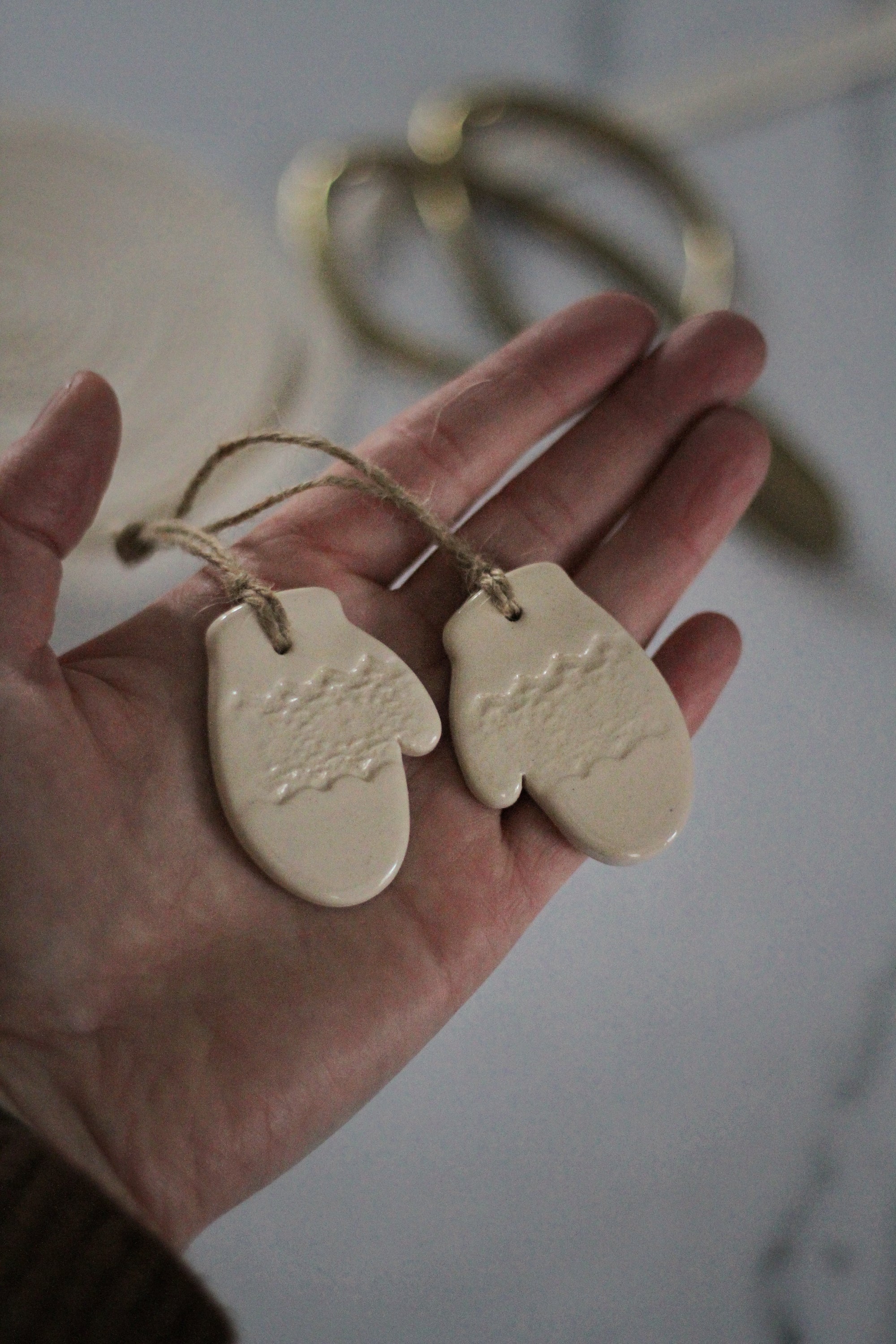 handmade pair of ceramic mitten tree decoration off white 